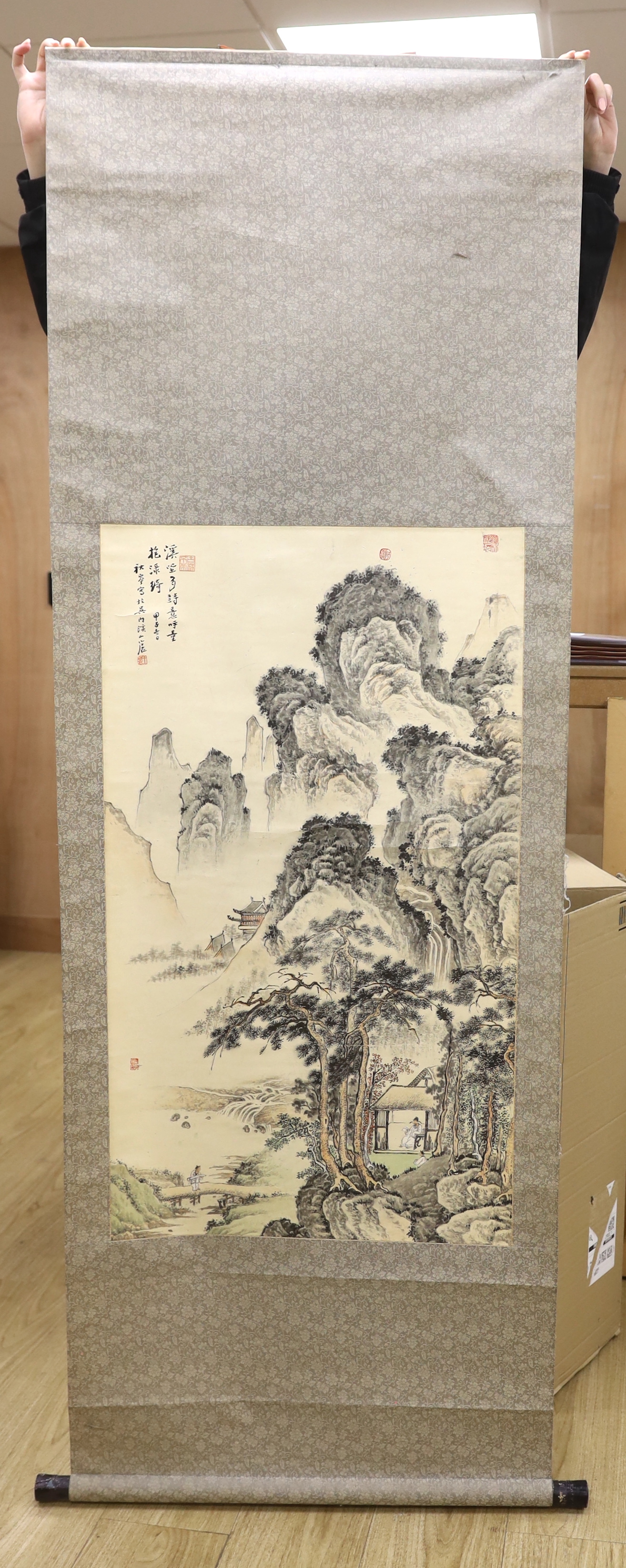 A Chinese painted scroll of a mountain scene, 182cm long